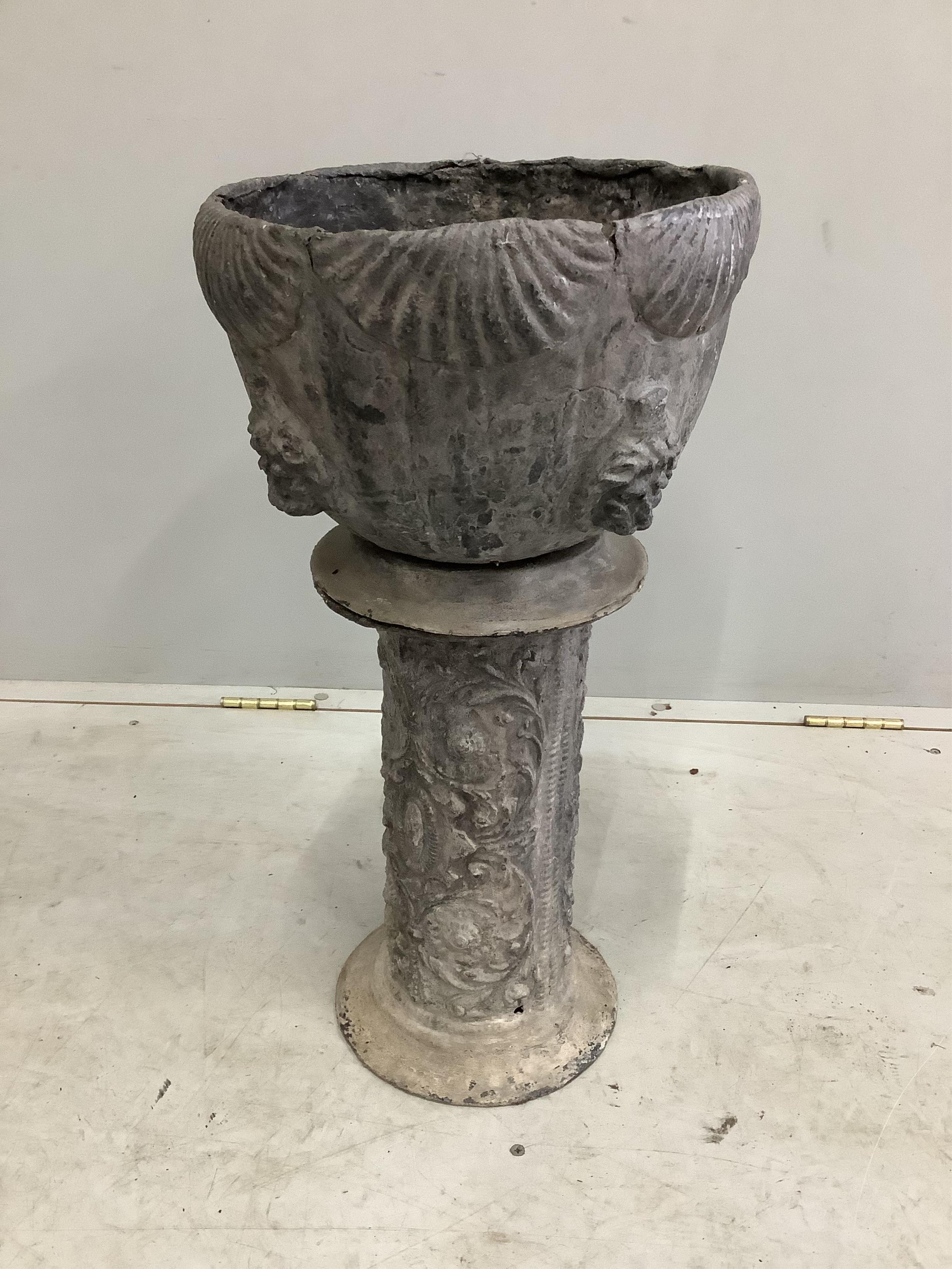 An Edwardian lead jardiniere with lions mask decoration standing upon a lead pedestal, diameter 33cm, height overall 61cm. Condition - fair to good